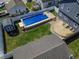 Private backyard with in-ground pool, patio area, and fenced yard at 97 N Maple St, Pittsboro, IN 46167