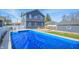 Aerial view of a home with a large, covered above ground pool at 97 N Maple St, Pittsboro, IN 46167