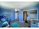 Spacious bedroom featuring ample closet space, a ceiling fan, and natural light, creating a versatile living area at 97 N Maple St, Pittsboro, IN 46167