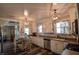 Bright eat-in kitchen with white cabinetry, stainless steel appliances, and modern lighting at 97 N Maple St, Pittsboro, IN 46167