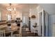 Well-lit kitchen featuring white cabinetry, ample counter space, and stylish light fixtures at 97 N Maple St, Pittsboro, IN 46167