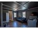 Inviting living room featuring a comfortable sofa, bright windows, and modern washer and dryer for convenience at 97 N Maple St, Pittsboro, IN 46167