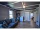 Cozy living room featuring a comfortable sofa, modern washer and dryer, and neutral wall color at 97 N Maple St, Pittsboro, IN 46167