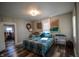Comfortable bedroom with neutral colors, wood-look floors and walk-in closet at 97 N Maple St, Pittsboro, IN 46167