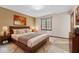 Comfortable bedroom with a large window and a modern minimalist style at 10673 Rolling Springs Dr, Indianapolis, IN 46234