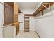 Spacious closet featuring shelving and metal hanging rods offering ample storage and organization solutions at 10673 Rolling Springs Dr, Indianapolis, IN 46234