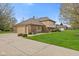 Two-story home with brick and siding, attached garage and driveway at 10673 Rolling Springs Dr, Indianapolis, IN 46234