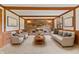 Inviting living room with brick fireplace, wood beam ceiling, and cozy seating at 10673 Rolling Springs Dr, Indianapolis, IN 46234