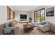 Bright living room featuring a comfortable seating area and natural light at 10673 Rolling Springs Dr, Indianapolis, IN 46234