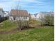 Backyard with new grass and small trees at 11403 Fairweather Pl, Indianapolis, IN 46229