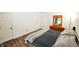 This bedroom features hardwood floors, white walls, and two doors to the left at 11403 Fairweather Pl, Indianapolis, IN 46229