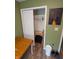 Bedroom closet with hanging clothes rod, storage, and laminate floors at 11403 Fairweather Pl, Indianapolis, IN 46229