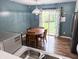 Eat-in dining area with sliding glass doors and views of the back yard at 11403 Fairweather Pl, Indianapolis, IN 46229
