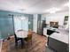 Bright kitchen with stainless steel appliances, an eat-in dining area, and neutral paint at 11403 Fairweather Pl, Indianapolis, IN 46229