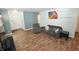 Comfortable living room with wood floors, neutral paint, and natural light at 11403 Fairweather Pl, Indianapolis, IN 46229