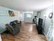 Spacious living room with wood floors and natural light throughout the home at 11403 Fairweather Pl, Indianapolis, IN 46229