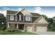 Charming two-story home featuring a brick-and-siding facade and a two-car garage at 11654 Aubrey Ln, Fishers, IN 46040