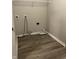 Laundry room with wood-look flooring and hookups at 125 Hilltop Farms Blvd, Whiteland, IN 46184