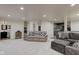 Finished basement with a sitting area, wet bar, and updated flooring throughout at 13875 Ambria Dr, McCordsville, IN 46055