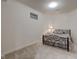 Cozy bedroom with neutral carpet, one small window, and accent table with lamp at 13875 Ambria Dr, McCordsville, IN 46055