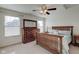 Bedroom with two windows and a wooden framed queen-sized bed complemented by a matching dresser and nightstand at 13875 Ambria Dr, McCordsville, IN 46055