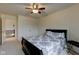 Bedroom featuring a ceiling fan, a closet, and a queen-sized bed with a patterned comforter and matching pillows at 13875 Ambria Dr, McCordsville, IN 46055