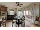 Dining room showcases wood floors and sliding door with view to outdoor deck at 13875 Ambria Dr, McCordsville, IN 46055