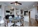 Dining room with access to kitchen and living room, features wood floors and staircase views at 13875 Ambria Dr, McCordsville, IN 46055