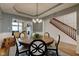 Cozy dining room with views into the living room and staircase at 13875 Ambria Dr, McCordsville, IN 46055