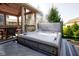 Backyard hot tub is on a deck with wooded surroundings and features a gazebo at 13875 Ambria Dr, McCordsville, IN 46055