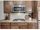 Close up of the kitchen cooktop featuring stainless steel appliances and granite countertops at 13875 Ambria Dr, McCordsville, IN 46055