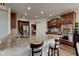 Spacious kitchen featuring granite countertops, stainless steel appliances, and dark wood cabinetry at 13875 Ambria Dr, McCordsville, IN 46055