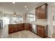 Updated kitchen featuring stainless steel appliances, granite countertops, and wood cabinetry at 13875 Ambria Dr, McCordsville, IN 46055