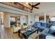 Open-concept living room with hardwood floors, fireplace, and a view to the dining and kitchen areas at 13875 Ambria Dr, McCordsville, IN 46055