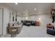 Finished basement featuring a comfortable living area with ample seating and decor at 13875 Ambria Dr, McCordsville, IN 46055