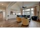 Bright and airy living room features hardwood floors, large windows, and an open layout at 13875 Ambria Dr, McCordsville, IN 46055