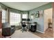 Inviting home office featuring comfortable seating, built-in shelving, and bright natural light at 13875 Ambria Dr, McCordsville, IN 46055