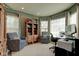 Inviting home office featuring comfortable seating, built-in shelving, and bright natural light at 13875 Ambria Dr, McCordsville, IN 46055