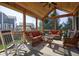 Bright and airy screened-in porch with wooded ceilings, comfortable seating, and great views at 13875 Ambria Dr, McCordsville, IN 46055