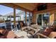 Relaxing screened-in porch with wooden accents, comfortable seating and backyard views at 13875 Ambria Dr, McCordsville, IN 46055