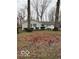Cozy single-story house with a well-kept lawn and mature trees around the house at 1536 W 74Th Pl, Indianapolis, IN 46260