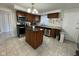 Functional kitchen featuring granite countertops, an island, and stainless steel appliances at 1536 W 74Th Pl, Indianapolis, IN 46260