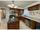 Modern kitchen with granite countertops, stainless steel appliances, and abundant cabinet space at 1536 W 74Th Pl, Indianapolis, IN 46260