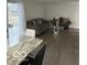 Bright living space with modern gray sofas and a contemporary glass coffee table at 1536 W 74Th Pl, Indianapolis, IN 46260