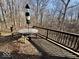 Relaxing back deck overlooking wooded scenery, offering a peaceful spot for outdoor dining and entertaining at 155 Boring Pl, Martinsville, IN 46151