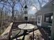 View of the lovely back deck with wooded view and table for entertaining at 155 Boring Pl, Martinsville, IN 46151