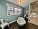Bright bathroom featuring a freestanding tub, walk-in shower, and natural light from the windows at 155 Boring Pl, Martinsville, IN 46151