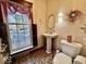 Bathroom with pedestal sink and tile flooring at 155 Boring Pl, Martinsville, IN 46151