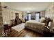 This bedroom features hard wood floors, windows with shutters and period wallpaper at 155 Boring Pl, Martinsville, IN 46151