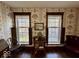 Vintage style bedroom showing windows with shutters, hard wood floors and period wallpaper at 155 Boring Pl, Martinsville, IN 46151